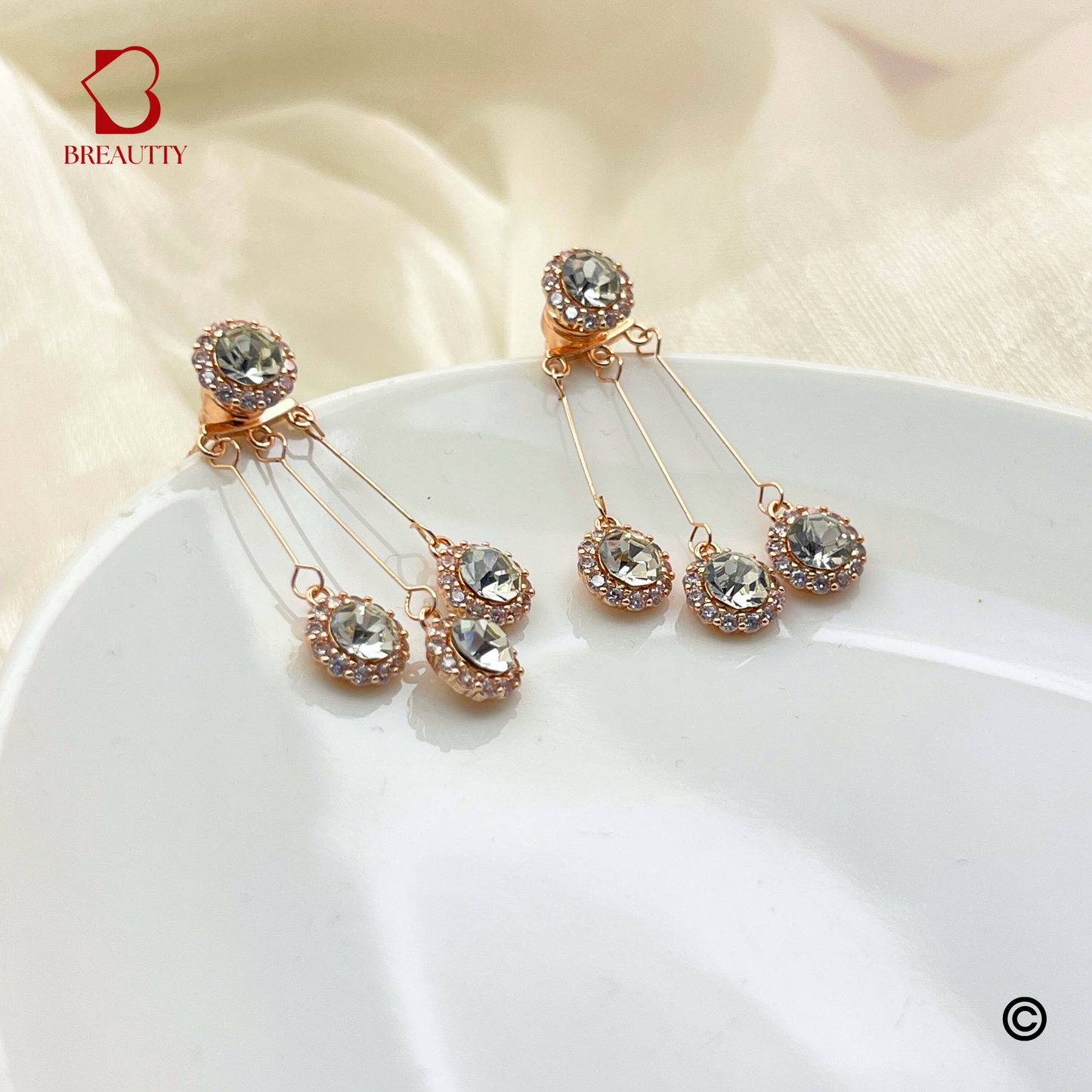 BREAUTTY FALLING DROPS EARRINGS IN ROSE GOLD PLATING