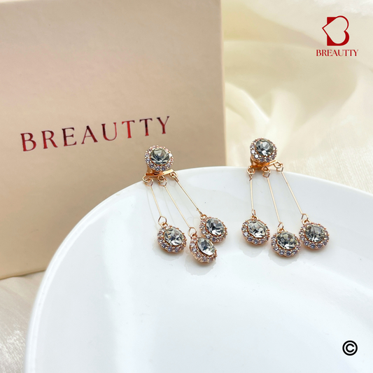BREAUTTY FALLING DROPS EARRINGS IN ROSE GOLD PLATING