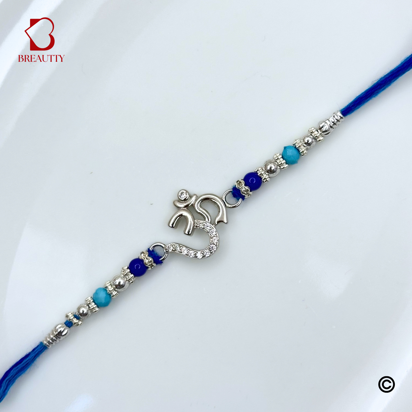 BREAUTTY RAKSHA BANDHAN 925 STERLING SILVER RAKHI  "OM"  WITH BLUE THREAD  | HALLMARKED SILVER  RAKHI