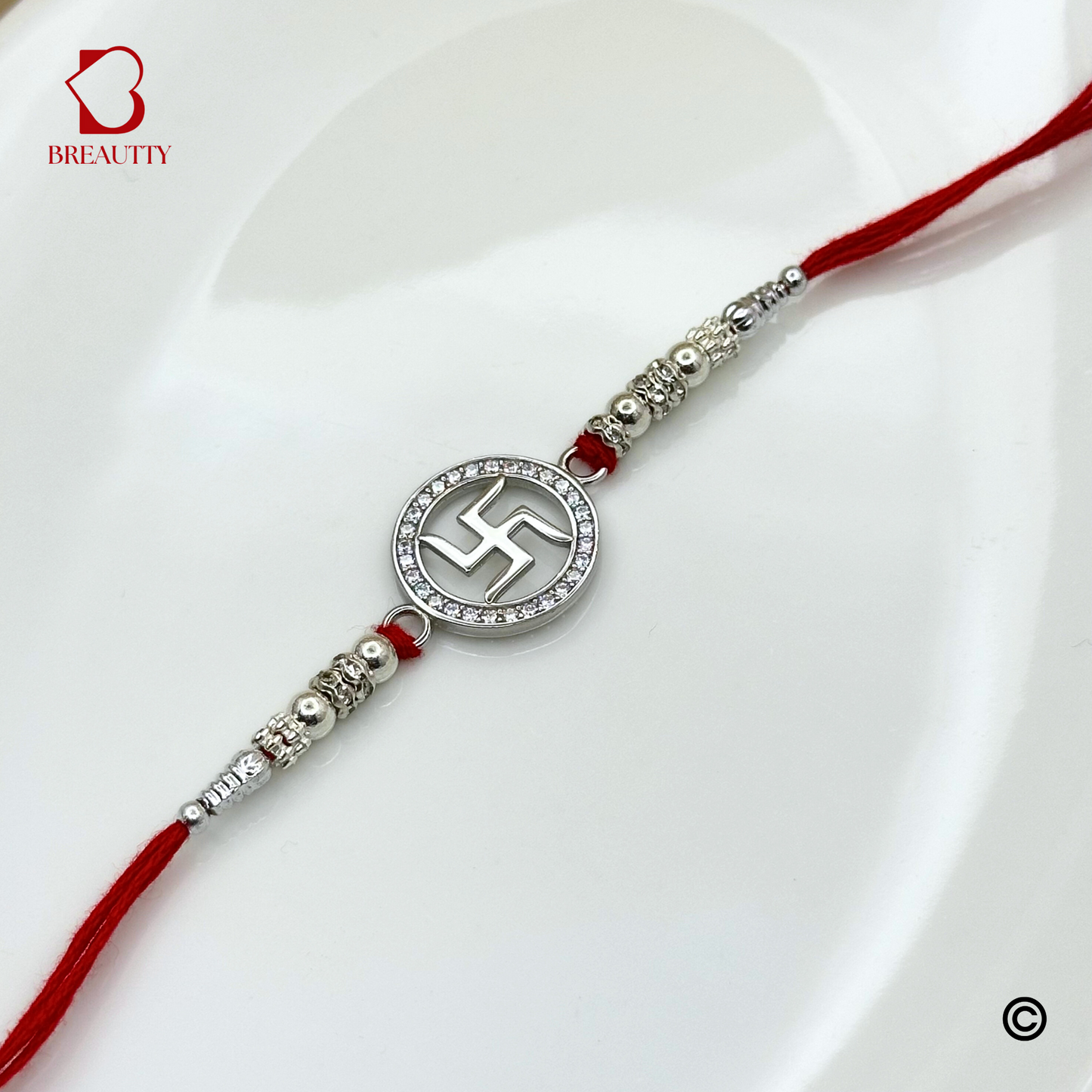 BREAUTTY RAKSHA BANDHAN 925 STERLING SILVER RAKHI  "SWASTIK"  WITH RED THREAD  | HALLMARKED SILVER  RAKHI
