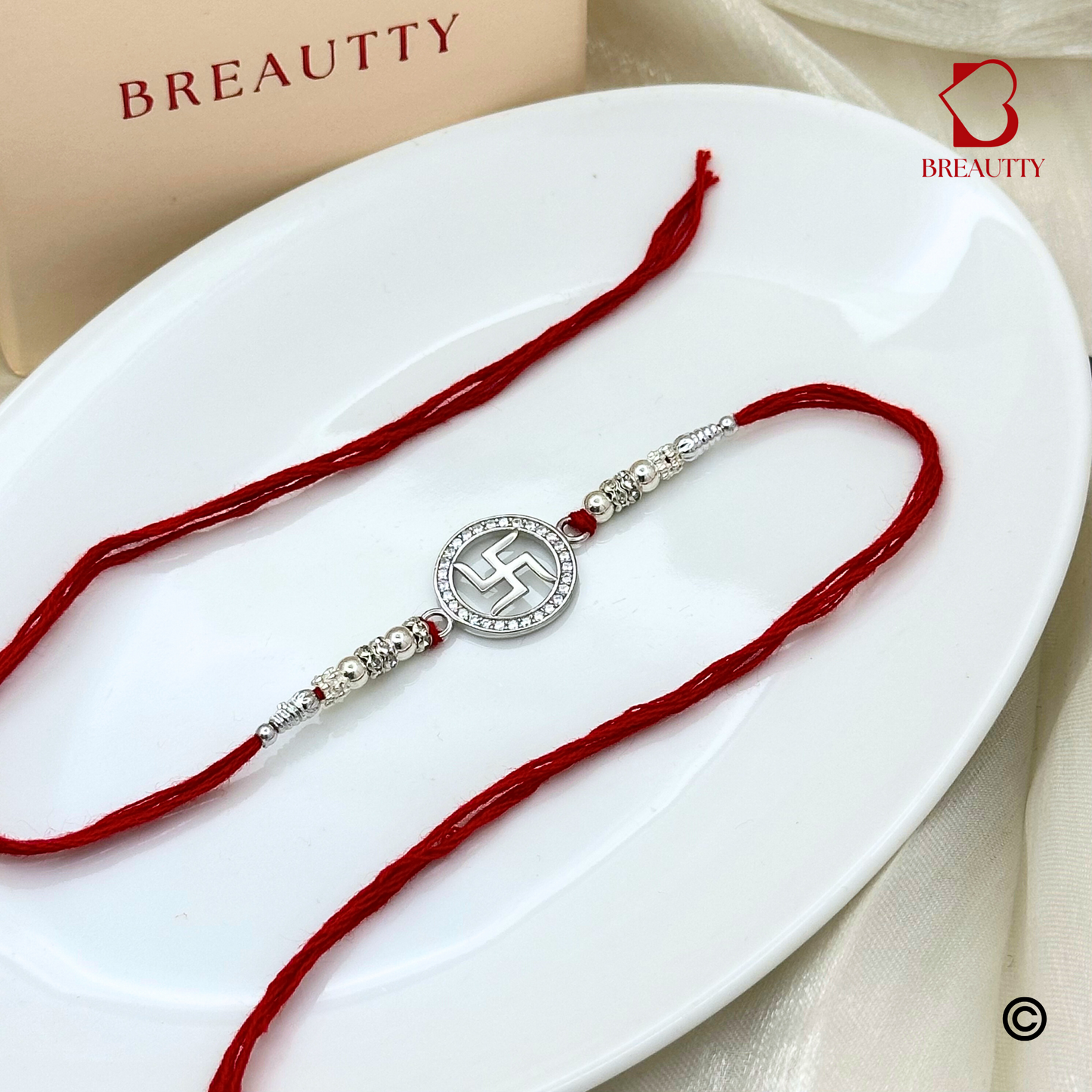 BREAUTTY RAKSHA BANDHAN 925 STERLING SILVER RAKHI  "SWASTIK"  WITH RED THREAD  | HALLMARKED SILVER  RAKHI