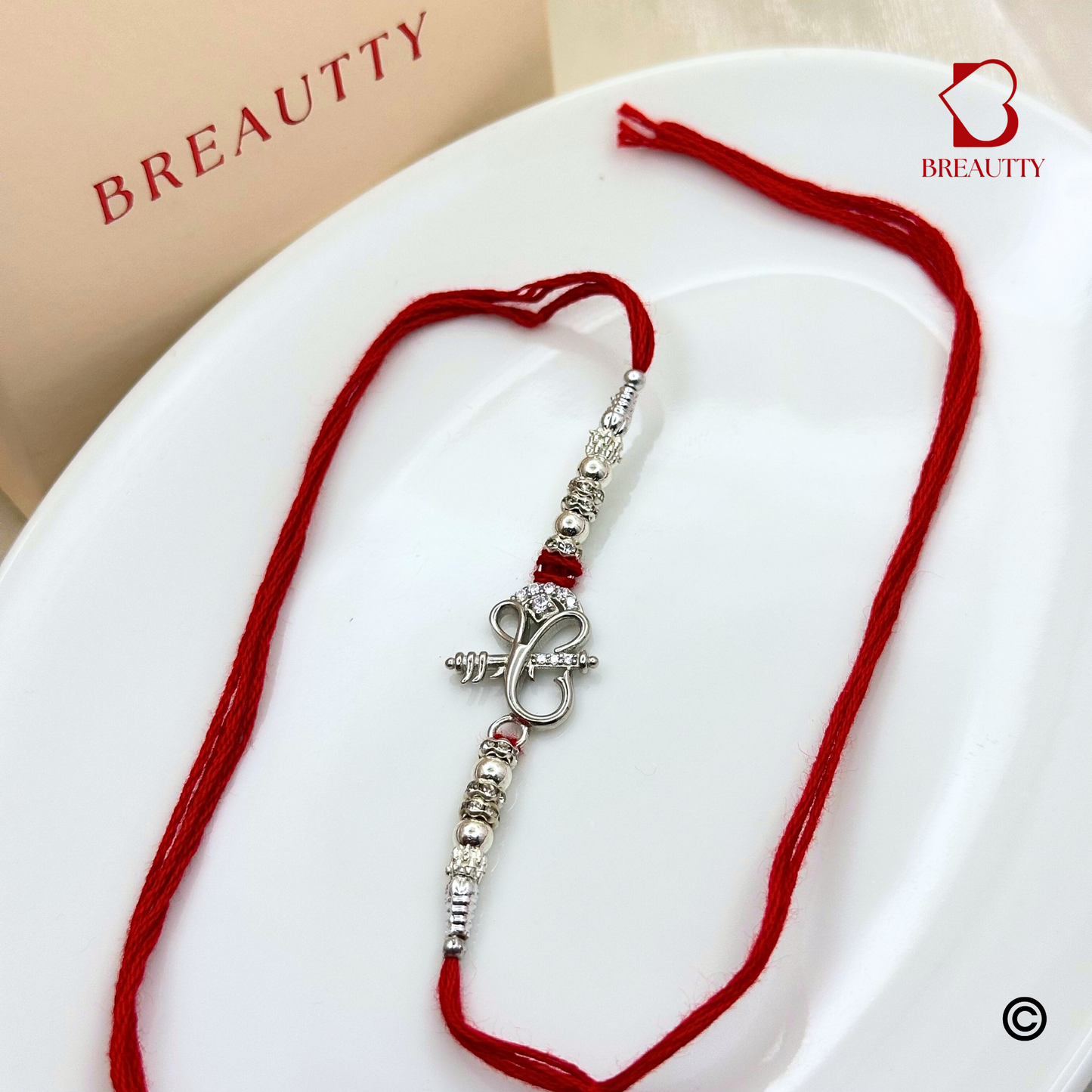 BREAUTTY RAKSHA BANDHAN 925 STERLING SILVER RAKHI  "GANESHA"  WITH RED THREAD  | HALLMARKED SILVER  RAKHI