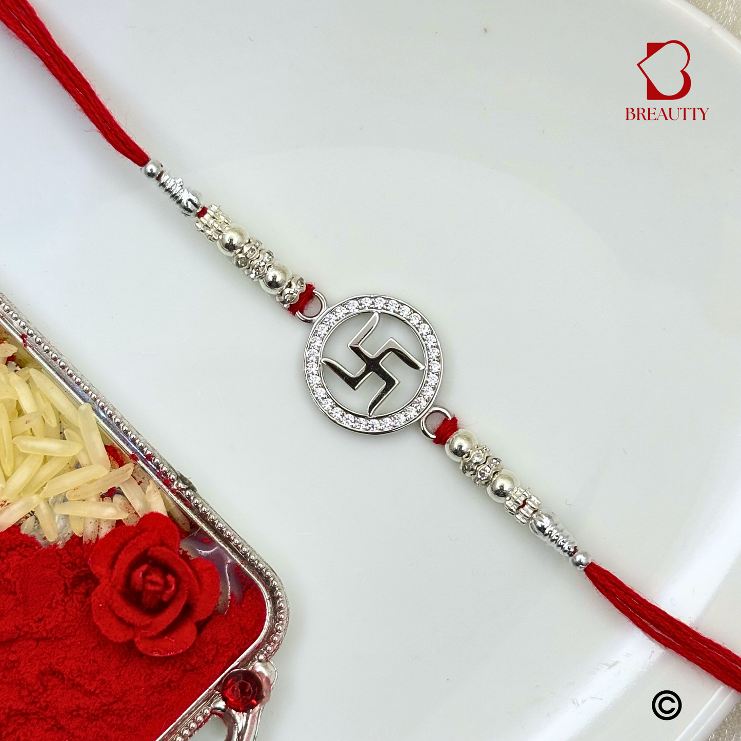 BREAUTTY RAKSHA BANDHAN 925 STERLING SILVER RAKHI  "SWASTIK"  WITH RED THREAD  | HALLMARKED SILVER  RAKHI