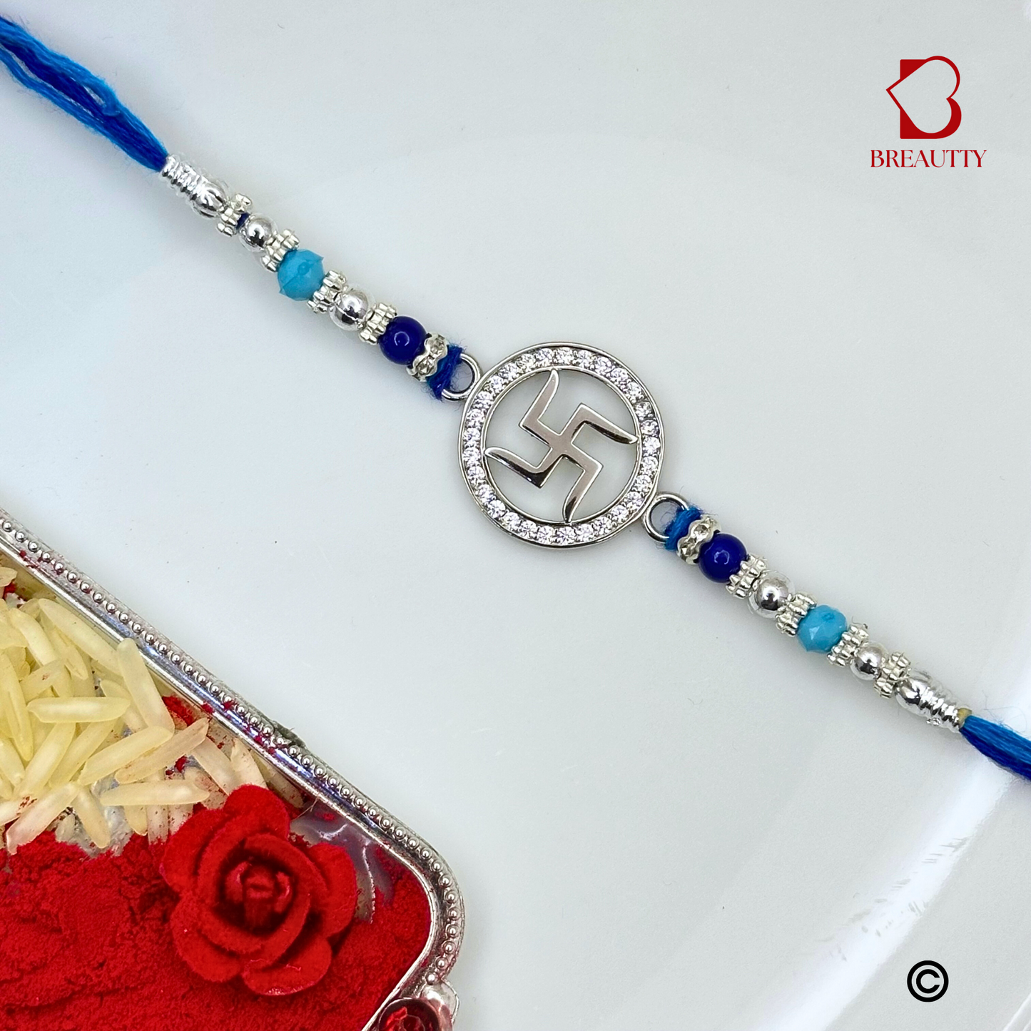 BREAUTTY RAKSHA BANDHAN 925 STERLING SILVER RAKHI  "SWASTIK"  WITH BLUE THREAD  | HALLMARKED SILVER  RAKHI