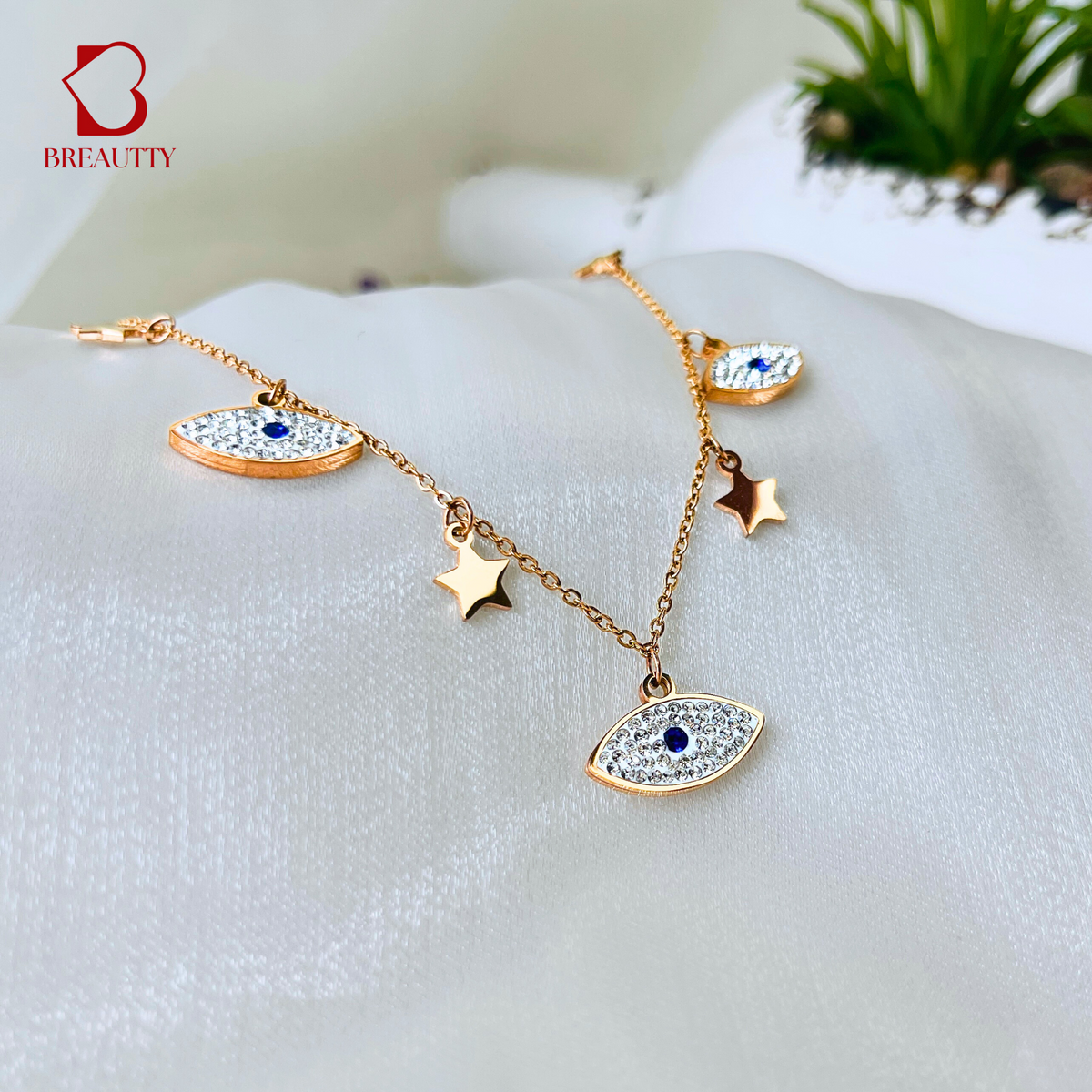 BREAUTTY ROSE GOLD PLATED  NECKLACE WITH EVIL EYE CHARMS AND STARS