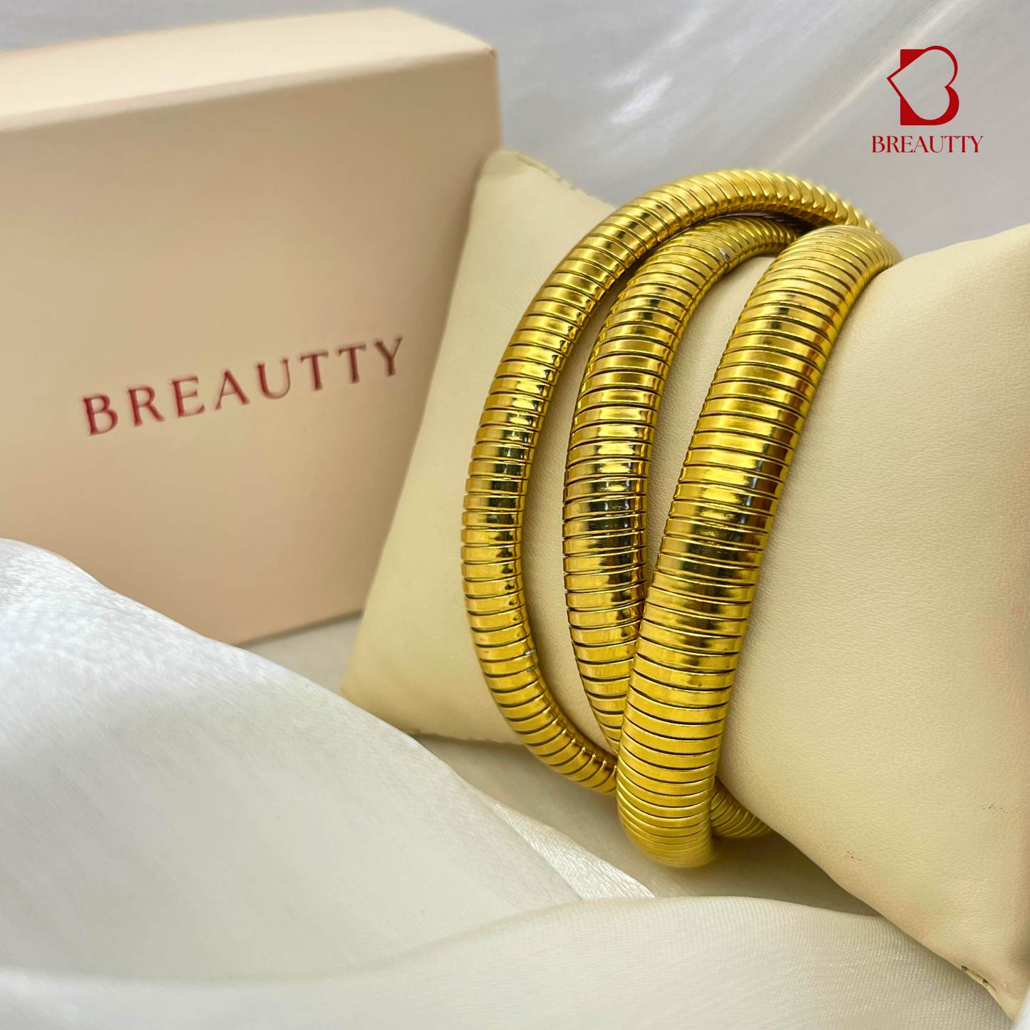 BREAUTTY TWISTED COIL STYLE BANGLE IN 18K GOLD POLISH | STAINLESS STEEL
