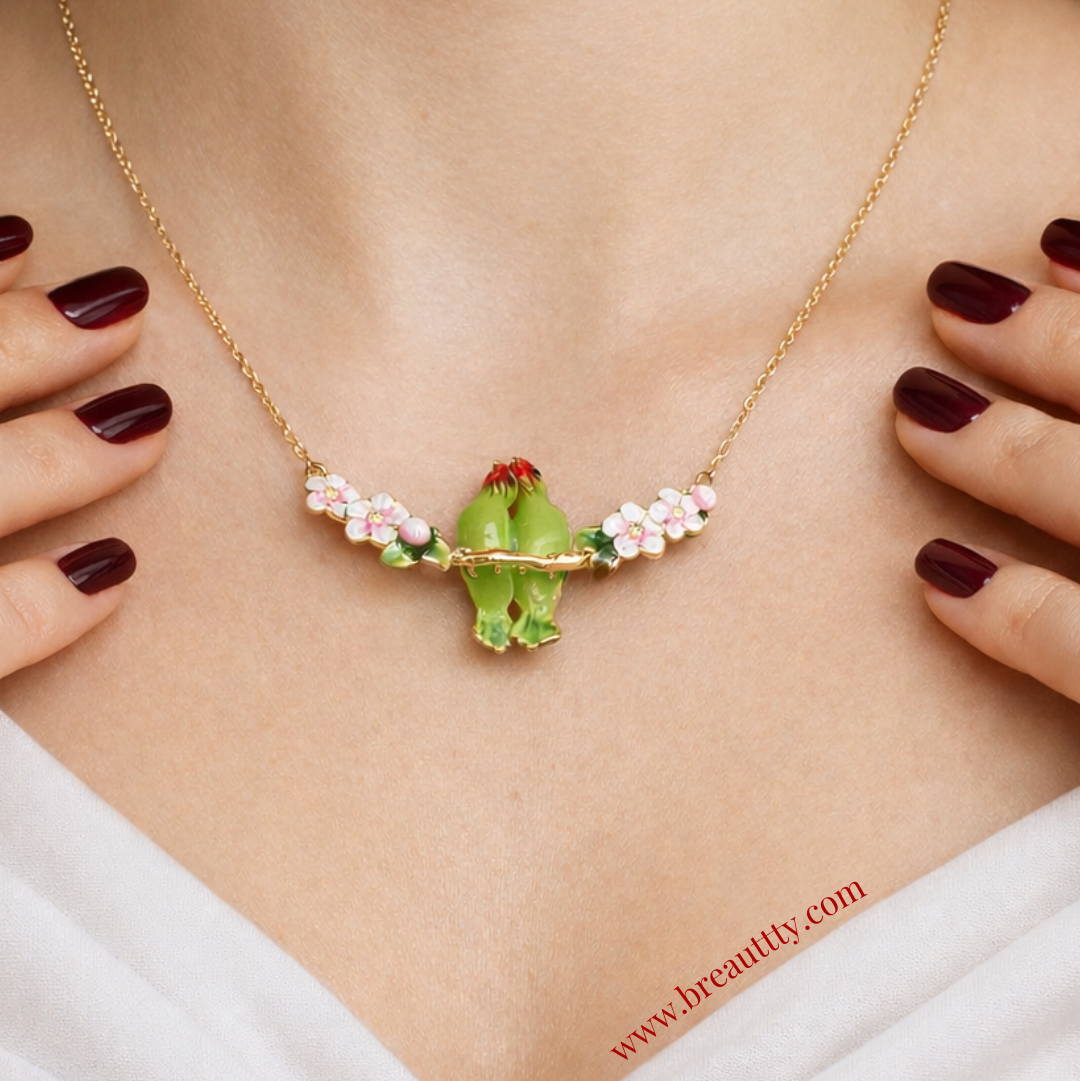 Necklace with a green frog pendant and pink flowers on a woman's neck. best gift for woman
